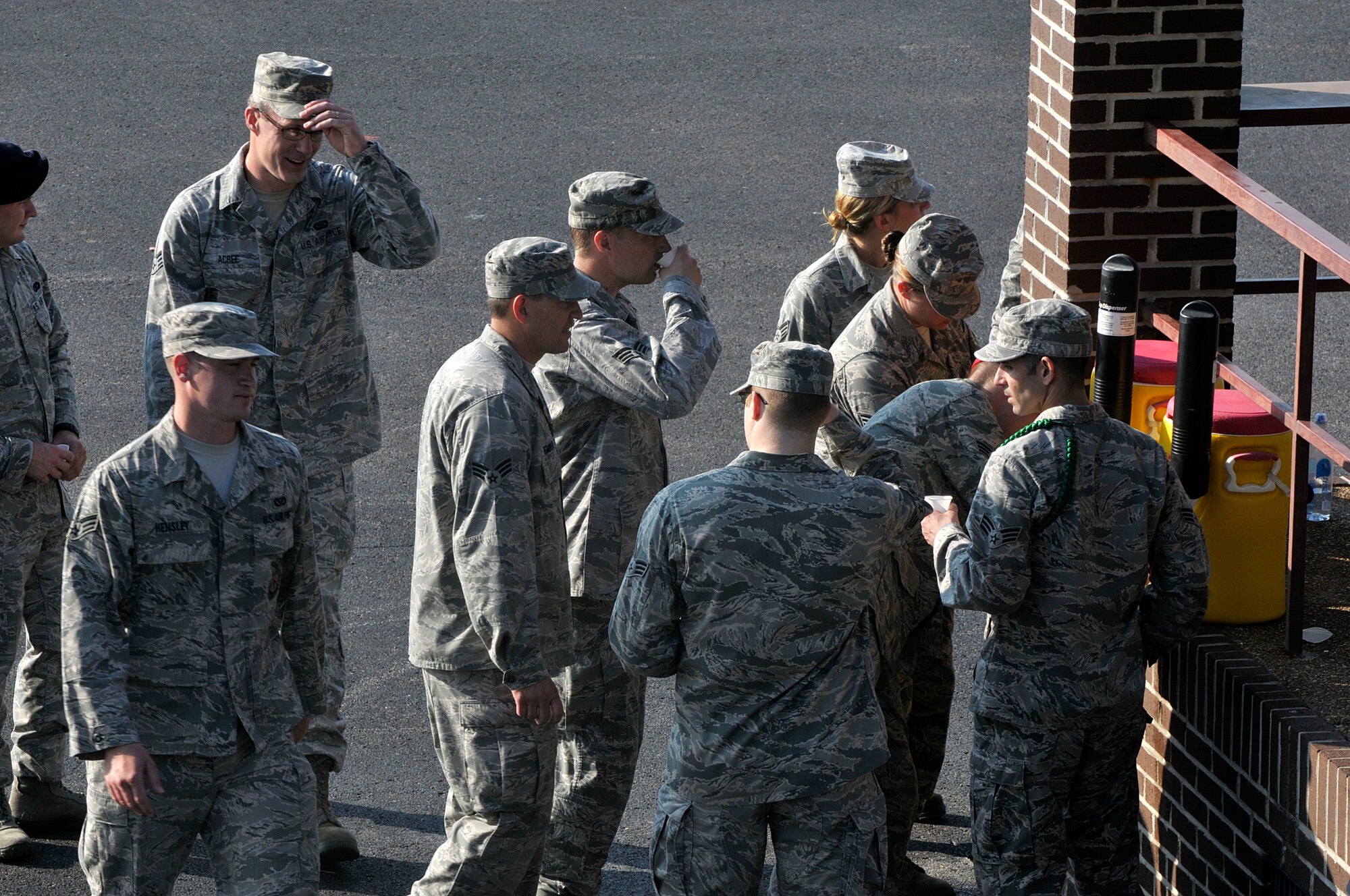 MCGHEE TYSON AIR NATIONAL GUARD BASE, Tenn. - Air National Guard Airmen from across the nation take a water break here June 17, 2014, with the late morning heat index rising on the parade ground of the I.G. Brown Training and Education Center. The Airmen are students in satellite Airman Leadership School and performed their summative evaluation for drill and ceremony. (U.S. Air National Guard photo by Master Sgt. Mike R. Smith/Released)