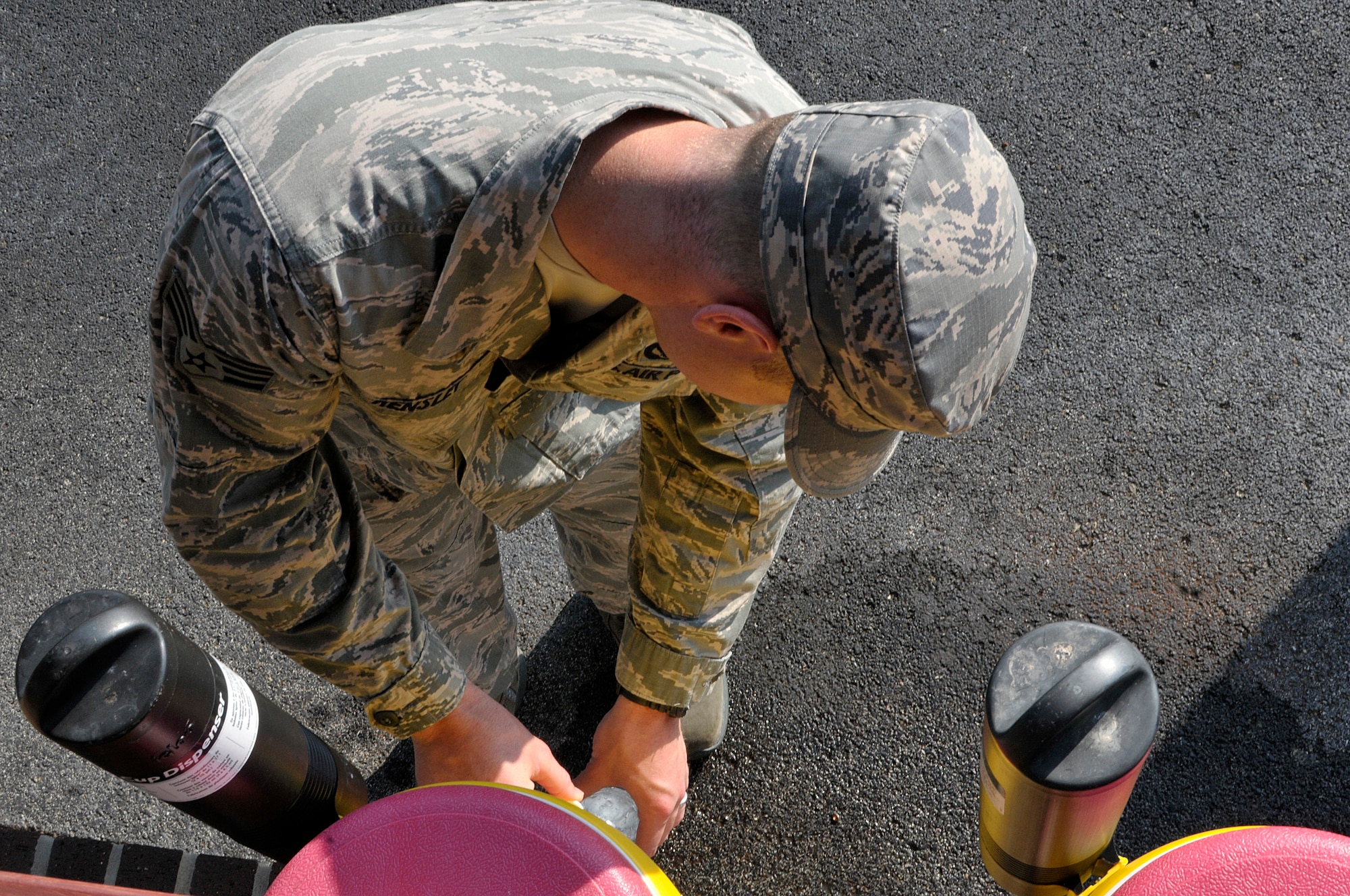 MCGHEE TYSON AIR NATIONAL GUARD BASE, Tenn. - Air National Guard Airmen from across the nation take a water break here June 17, 2014, with the late morning heat index rising on the parade ground of the I.G. Brown Training and Education Center. The Airmen are students in satellite Airman Leadership School and performed their summative evaluation for drill and ceremony. (U.S. Air National Guard photo by Master Sgt. Mike R. Smith/Released)