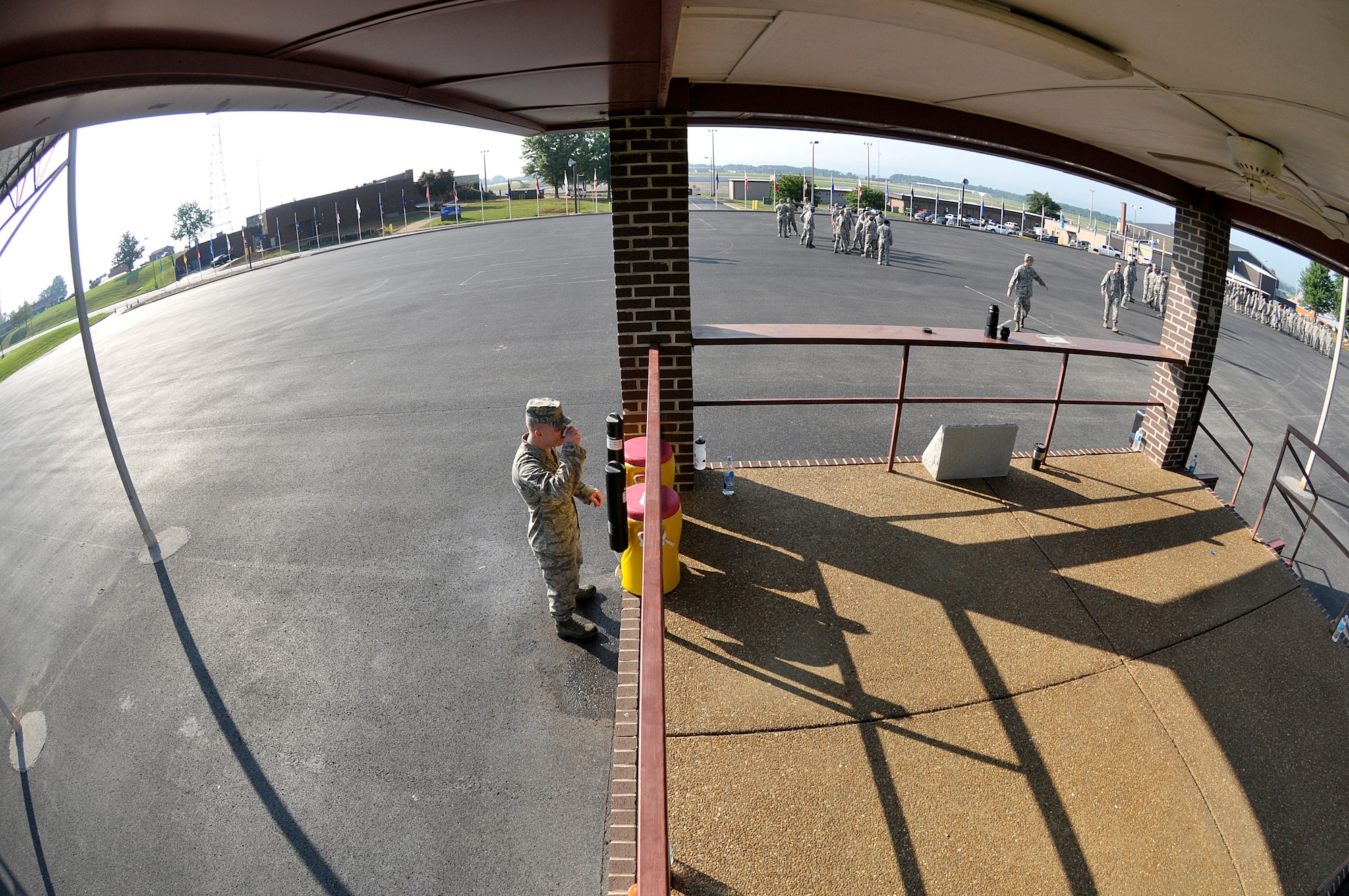 MCGHEE TYSON AIR NATIONAL GUARD BASE, Tenn. - Air National Guard Airmen from across the nation take a water break here June 17, 2014, with the late morning heat index rising on the parade ground of the I.G. Brown Training and Education Center. The Airmen are students in satellite Airman Leadership School and performed their summative evaluation for drill and ceremony. (U.S. Air National Guard photo by Master Sgt. Mike R. Smith/Released)