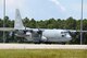 A U.S. Navy C-130 taxis down the runway at Tyndall Air Force Base June 13 in support of Naval exercise “Rim of the Pacific.” Personnel from the 325th Logistics Readiness Squadron participated in the joint operation by loading cargo and equipment in to the aircraft. (U.S. Navy courtesy photo)