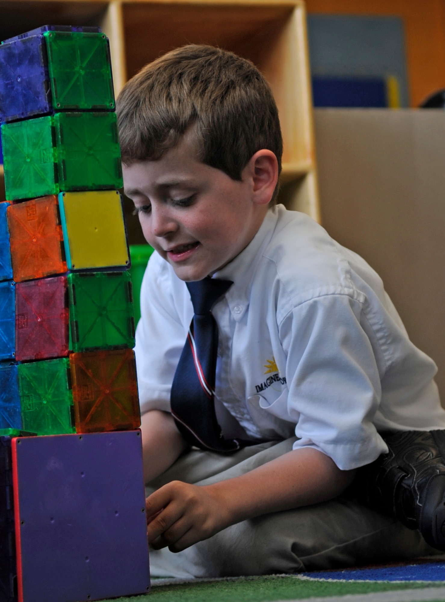 Zachary Hjelstrom plays with blocks at the Joint Base Andrews Youth Center as part of an Air Force School-Age Program, June 4, 2014. SAP’s mission is to provide a safe, supervised and healthy environment for children that supports success in school, literacy, community involvement, recreational and leisure activities.  (U.S. Air Force photo/ Senior Airman Mariah Haddenham)