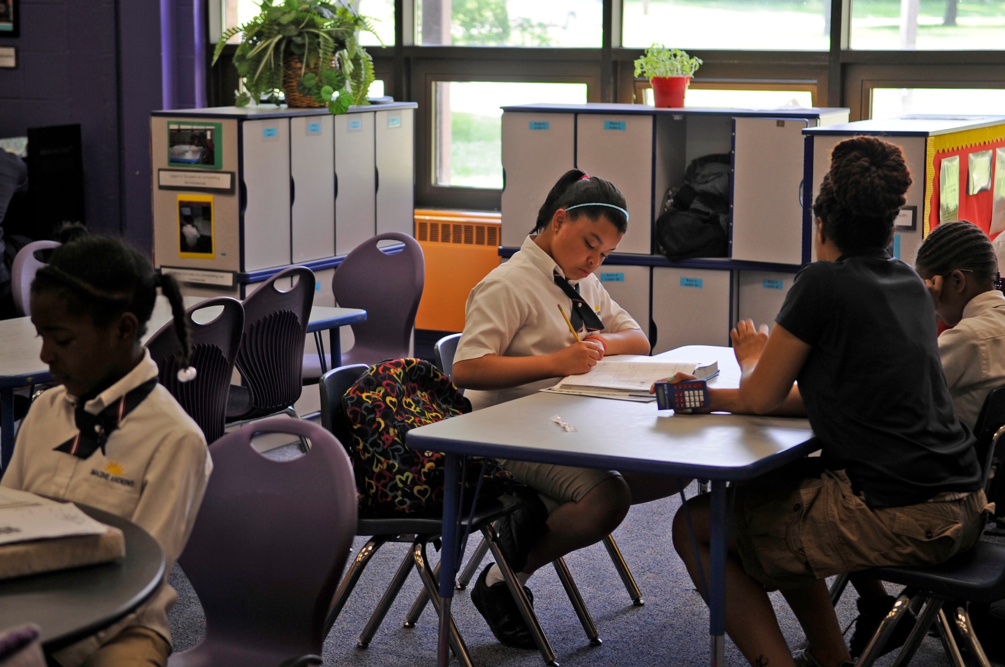 Kendall Roy works on an assignment at the Joint Base Andrews Youth Center as part of an Air Force School-Age Program, June 4, 2014. SAP’s mission is to provide a safe, supervised and healthy environment for children that supports success in school, literacy, community involvement, recreational and leisure activities.  (U.S. Air Force photo/ Senior Airman Mariah Haddenham)