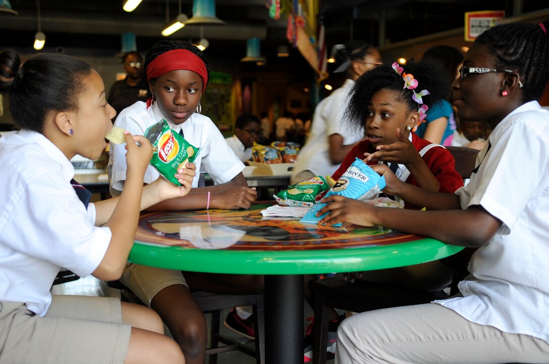 Students converse at the Joint Base Andrews Youth Center as part of an Air Force School-Age Program, June 4, 2014. SAP’s mission is to provide a safe, supervised and healthy environment for children that supports success in school, literacy, community involvement, recreational and leisure activities.  (U.S. Air Force photo/ Senior Airman Mariah Haddenham)