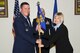 GOODFELLOW AIR FORCE BASE, Texas -- Col. Dominic J. Bernardi III, 17th Mission Support Group Commander, passes the 17th Force Support Squadron guidon to Toni L. Hansen, during a change of leadership ceremony at the Event Center here June 13. Hansen assumed responsibility of the 17th FSS from Lt. Col. Ryan R. Dahl. (U.S. Air Force photo/ Staff Sgt. Laura R. McFarlane)