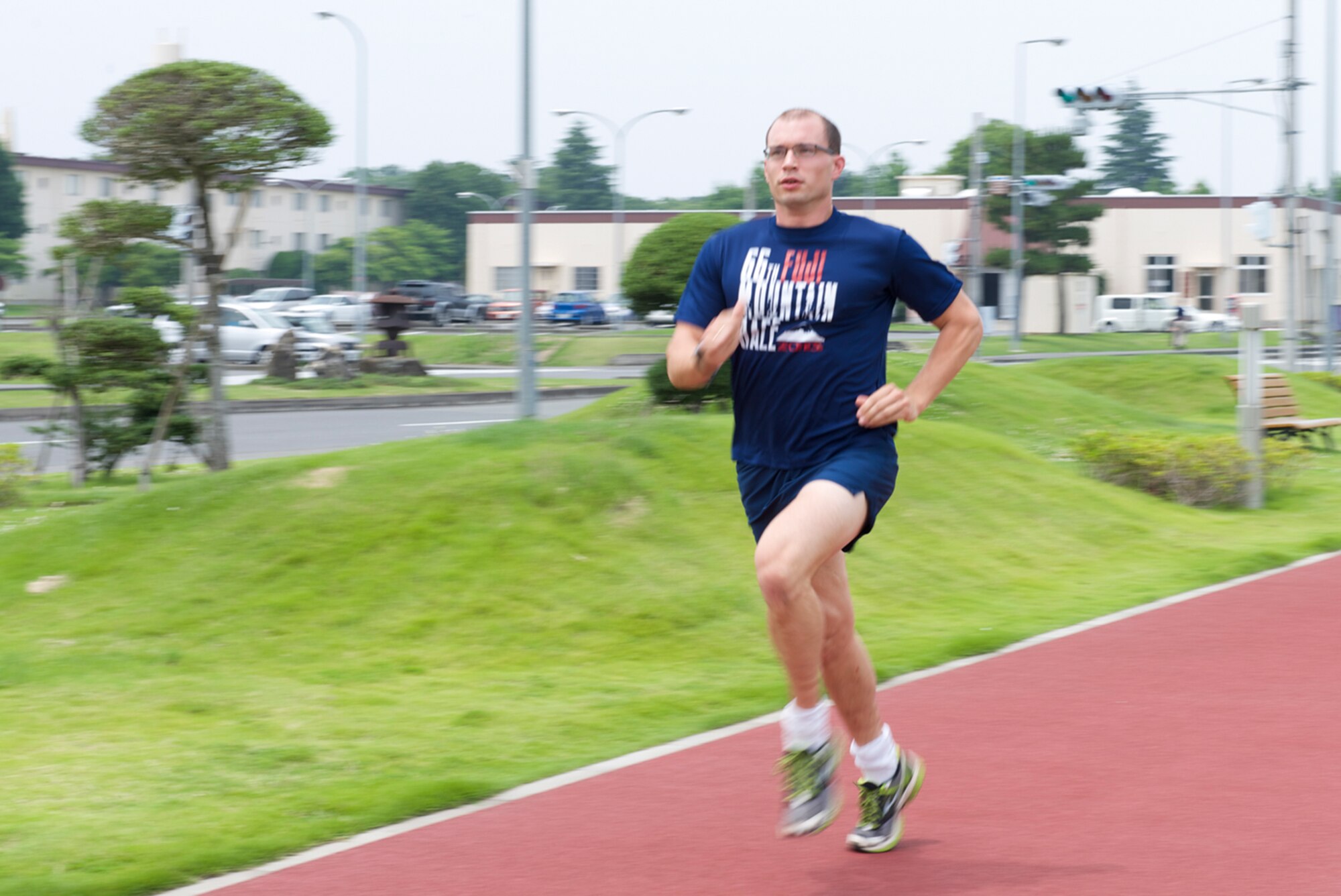 2nd Lt. Herman Reinhold, 374th Force Support Squadron readiness and plans chief, trains for the Air Force marathon at Yokota Air Base, Japan, June 17, 2014. Reinhold is one of ten Airmen that will represent PACAF in the Air Force Marathon at Wright-Patterson AFB, Ohio.  (U.S. Air Force photo by Airman 1st Class David Danford/Released)