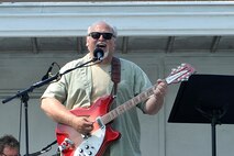 Rick Spurgeon, guitarist with the Rick Spurgeon and Out of the Fire band, entertains the crowd during the Offutt Advisory Council’s annual Offutt Appreciation Day Picnic held at the Offutt Base Lake on Offutt Air Force Base, Nebraska, June 6. The picnic had various activities and performances for all ages to enjoy. (U.S. Air Force photo by Charles Haymond/Released)