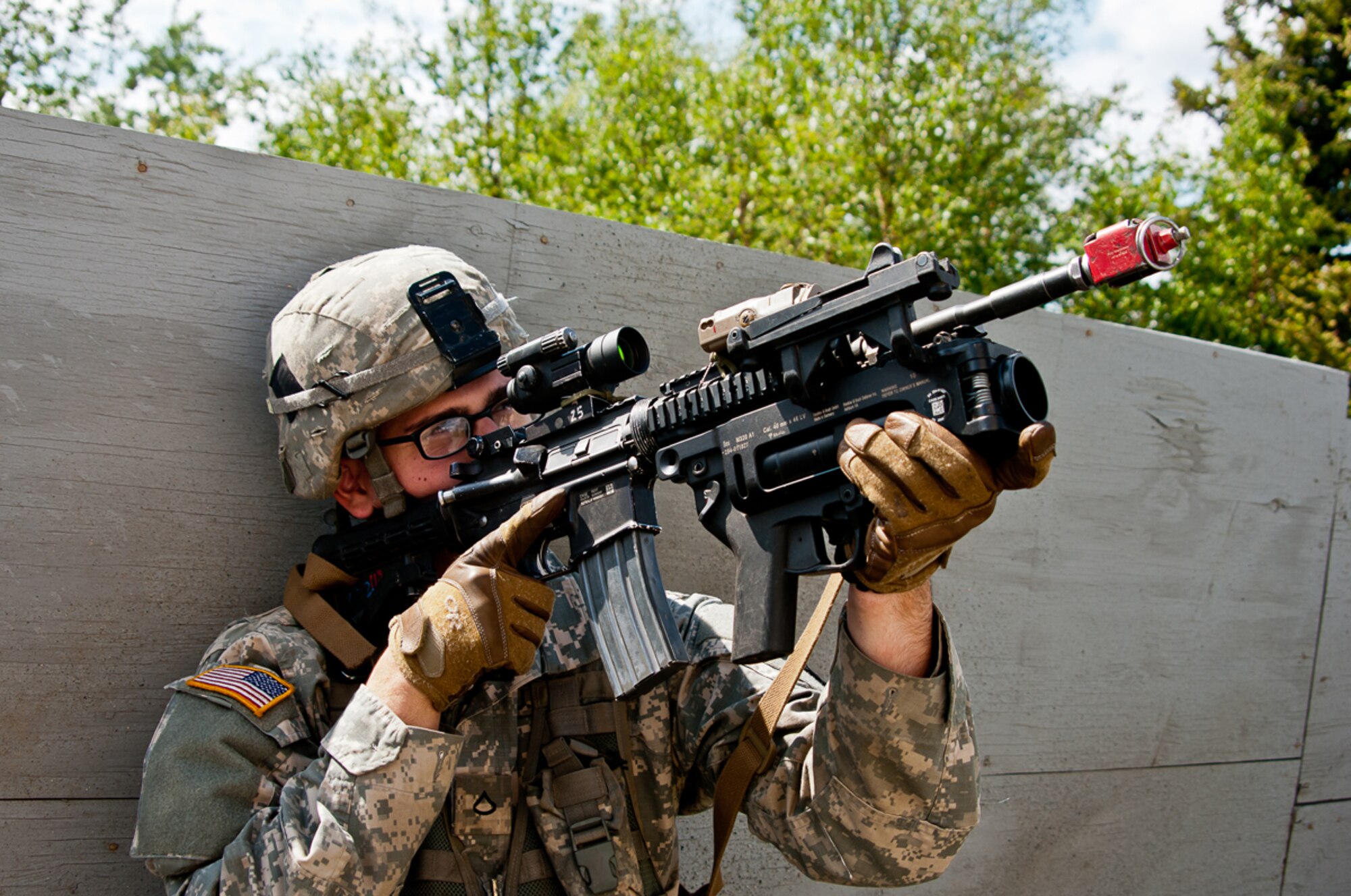 A paratrooper with the 1st Battalion, 501st Infantry Regiment, 4th Infantry Brigade Combat Team (Airborne), 25th Infantry Division provides security at a mock village at Donnelly Training Area near Fort Greely, Alaska, June 8, 2014. The exercise was part of a three-day, joint forcible-entry exercise to train on airfield seizure operations and wide area security as part of the Spartan Brigade's certification as the Army's Contingency Response Force for the Pacific Theater. (U.S. Army photo by/Sgt. Eric-James Estrada)