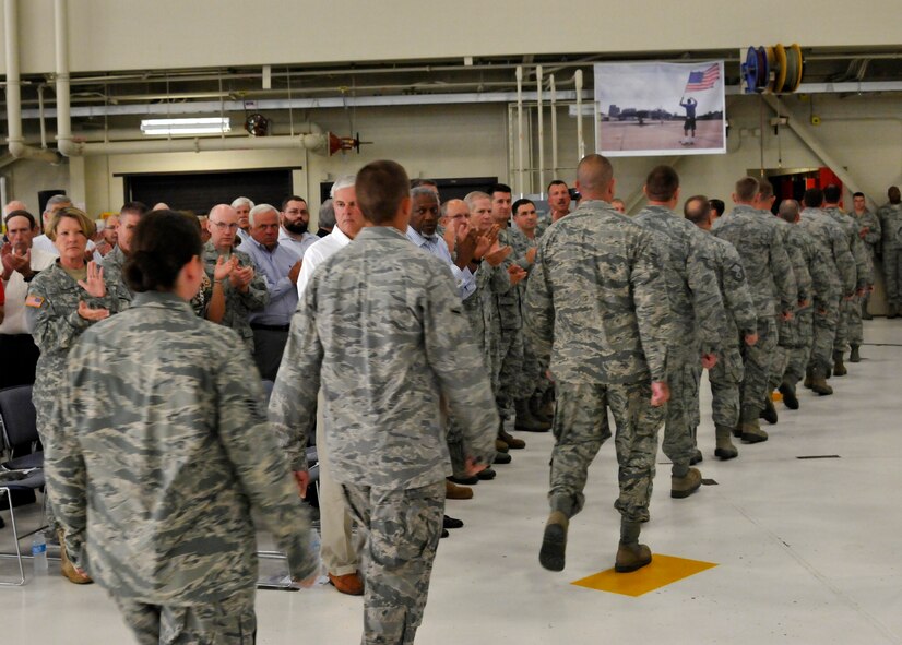 Members of the 188th Maintenance Group march from their formations following the group’s inactivation during the 188th Wing’s Conversion Day ceremony June 7. The 188th Maintenance Group, 188th Maintenance Squadron, 188th Aircraft Maintenance Squadron and 188th Maintenance Operations Flight were inactivated as a result of the 188th’s conversion to a remotely piloted aircraft (MQ-9 Reapers) and intelligence, surveillance and reconnaissance mission. (U.S. Air National Guard photo by Airman 1st Class Cody Martin)