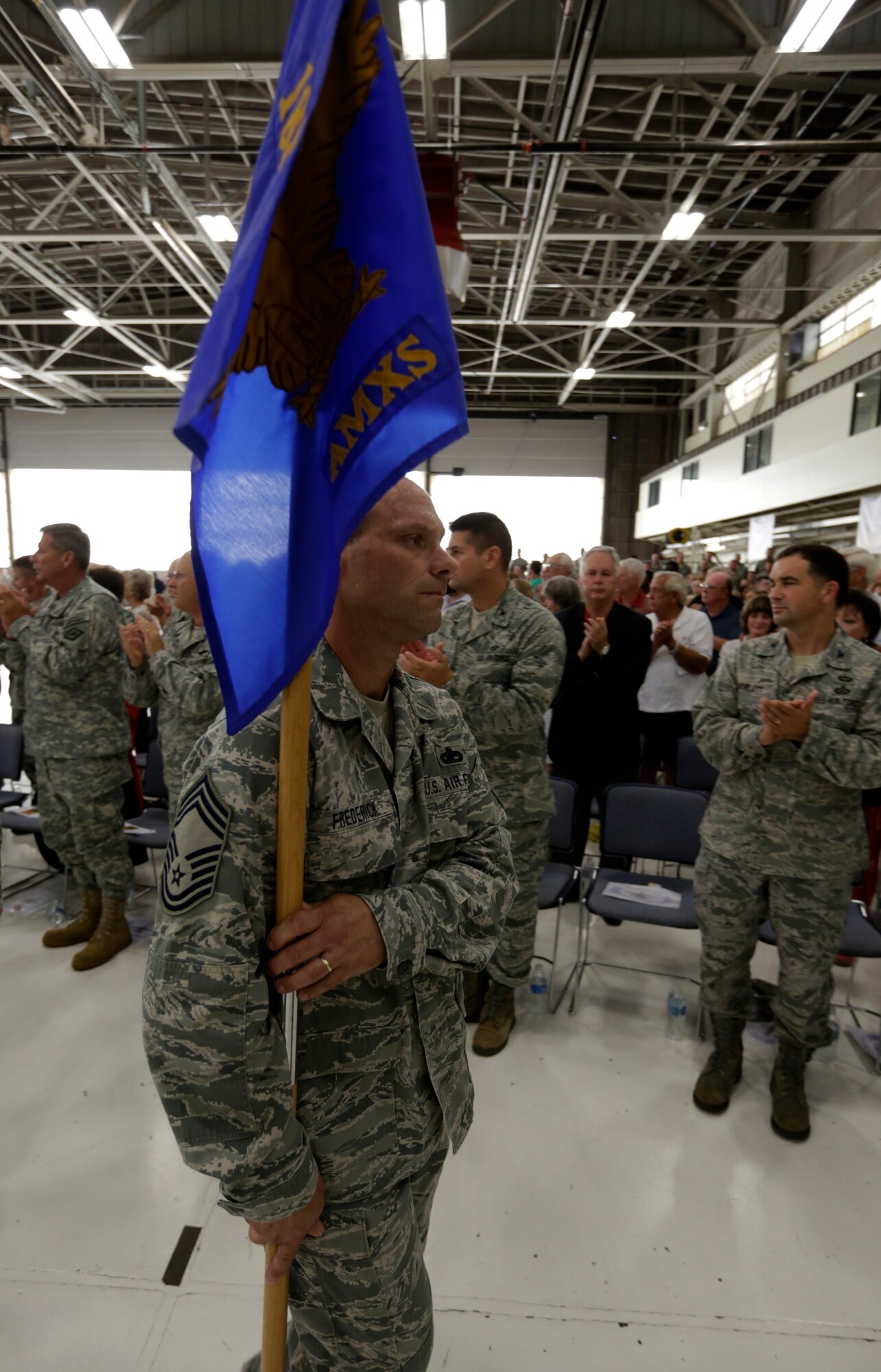 Chief Master Sgt. Donnie Frederick marches with the 188th Aircraft Maintenance Squadron guidon in formation at the 188th Wing’s Conversion Day ceremony June 7. The 188th Maintenance Group, 188th Maintenance Squadron, 188th Aircraft Maintenance Squadron and 188th Maintenance Operations Flight were inactivated as a result of the 188th’s conversion to a remotely piloted aircraft (MQ-9 Reapers) and intelligence, surveillance and reconnaissance mission. (U.S. Air National Guard photo by Master Sgt. Mark Moore)