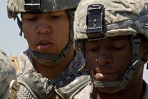 Members of the 791st Missile Security Forces Squadron wait for further instructions during the Top Dog competition at Minot Air Force Base, N.D., June 12, 2014. The competition is held quarterly as a way to boost morale throughout the squadron. (U.S. Air Force photo/Senior Airman Brittany Y. Bateman)