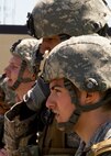 Members of the 791st Missile Security Forces Squadron wait for further instructions during the Top Dog competition at Minot Air Force Base, N.D., June 12, 2014. The competition is held quarterly as a way to boost morale throughout the squadron. (U.S. Air Force photo/Senior Airman Brittany Y. Bateman)