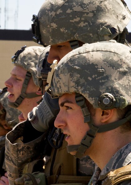 Members of the 791st Missile Security Forces Squadron wait for further instructions during the Top Dog competition at Minot Air Force Base, N.D., June 12, 2014. The competition is held quarterly as a way to boost morale throughout the squadron. (U.S. Air Force photo/Senior Airman Brittany Y. Bateman)