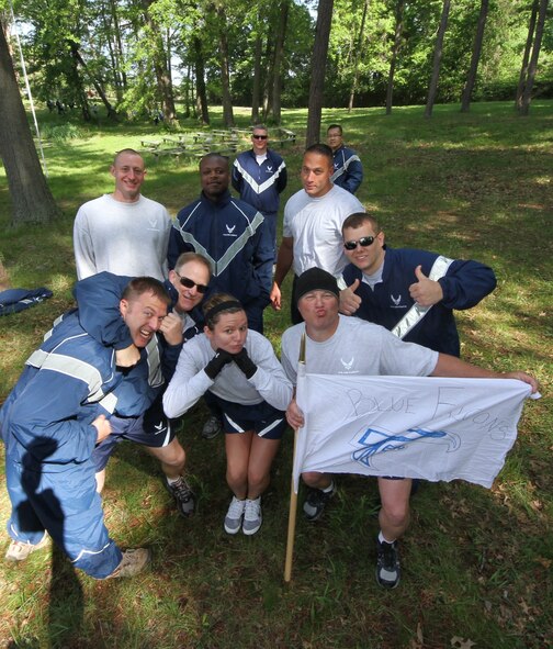 Members of 932nd Maintenance Group's "Team Blue Falcon" pose for  a photo after competing in a number of physical activities.  In May the 932nd Airlift Wing Maintenance Group participated in a daylong training event focused on building camaraderie, developing leadership skills and physical training. (U.S. Air Force photo by Tech. Sgt. Christopher Parr)  