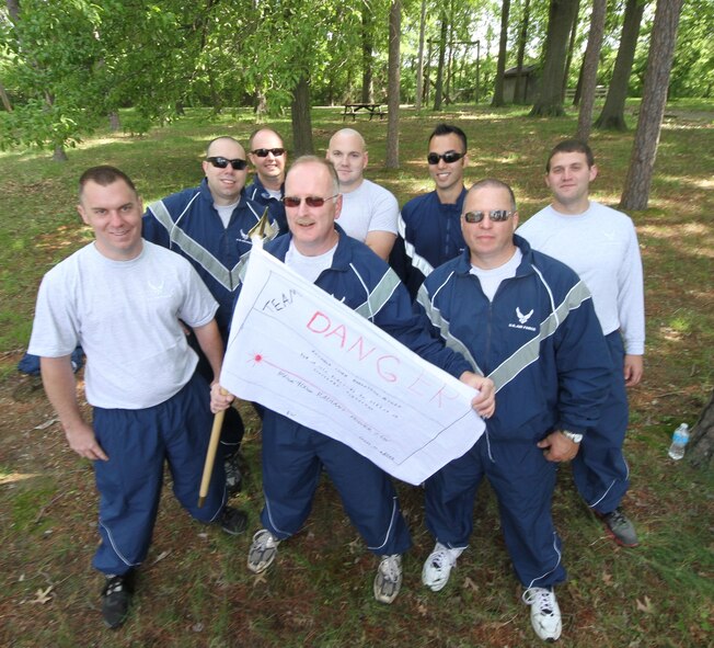 Members of 932nd Maintenance Group's "Team Danger" pose for a photo after competing in a number of physical activities.  In May the 932nd Airlift Wing Maintenance Group participated in a daylong training event focused on building camaraderie, developing leadership skills and physical training. (U.S. Air Force photo by Tech. Sgt. Christopher Parr)  