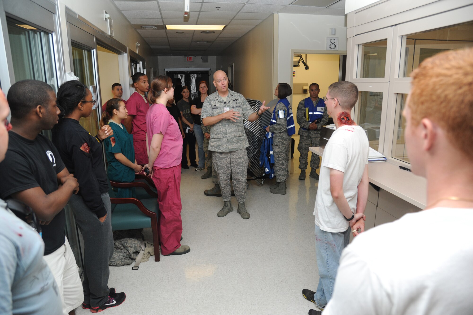 Col. Thomas Harrell, 81st Medical Squadron commander, thanks Wing Inspection team members, role players and volunteers for assisting in Keesler's active shooter exercise, June 11, 2014, at the Keesler Medical Center, Keesler Air Force Base, Miss.  An Air Force student simulated opening fire at the hospital after feeling he was wrongfully diagnosed.  The exercise tested the base's ability to respond to and recover from a mass casualty event.  (U.S. Air Force photo by Kemberly Groue)