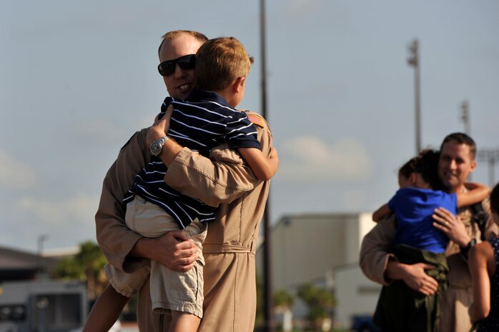 Members of the 14th Airlift Squadron greet their families during their redeployment from Southeast Asia, June 16, 2014, at Joint Base Charleston, S.C. Deployed to the 816th Expeditionary Airlift Squadron, the crews flew and supported 1,285 sorties, logged more than 3,000 combat flying hours and air-lifted more than 40 million pounds of cargo. (U.S. Air Force photo/Staff Sgt. Renae Pittman)
