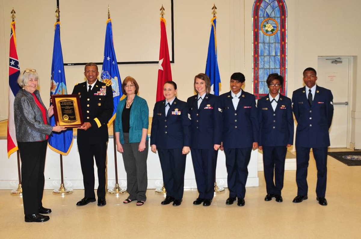 Mary Dixon, director of the Defense Manpower Data Center presents the Department of Defense ID/DEERS award to Major General Augustus L. Collins, Adjutant General State of Mississippi, at Thompson, Field, Jackson , Mississippi on April 5, 2014. The 172d Force Support Squadron Customer Service Section was recognized for their commitment and dedication to excellence in customer service from October 1, 2012 through September 30, 2013. The recipients of the award are (Ret) Master Sgt. Theresa Hinton, Tech. Sgt. Holly Tucker, Senior Airman Josie Morehead, Airman 1st Class Brittney Ross, Airman 1st Class Bradley Lawyer, and Airman Lakisha Vaughn (U.S. Air Force photo by Tech. Sgt. Marvin B. Moore/Release) — with Theresa Miller Hinton, Holly Tucker and Josie Wicker Morehead.