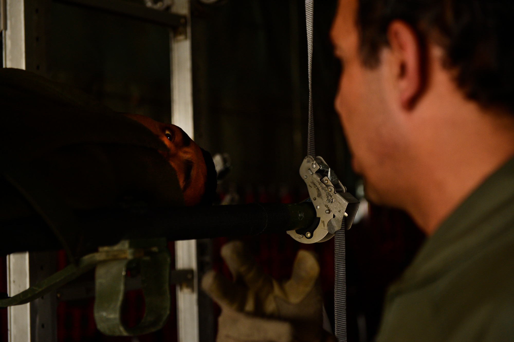 Sgt. Shanawaz Nabi Zada, Afghan Air Force load master, observes on a litter patient during an Afghan National Army casualty evacuation mission, Camp Bastion, Afghanistan, May 19, 2014. Afghan load masters led the CASEVAC mission involving Afghans injured during combat operation. Falcho, a South Park, Pennsylvania native, is deployed from the 62nd Airlift Squadron, Little Rock, Arkansas. (U.S. Air Force photo by Staff Sgt. Vernon Young Jr.)