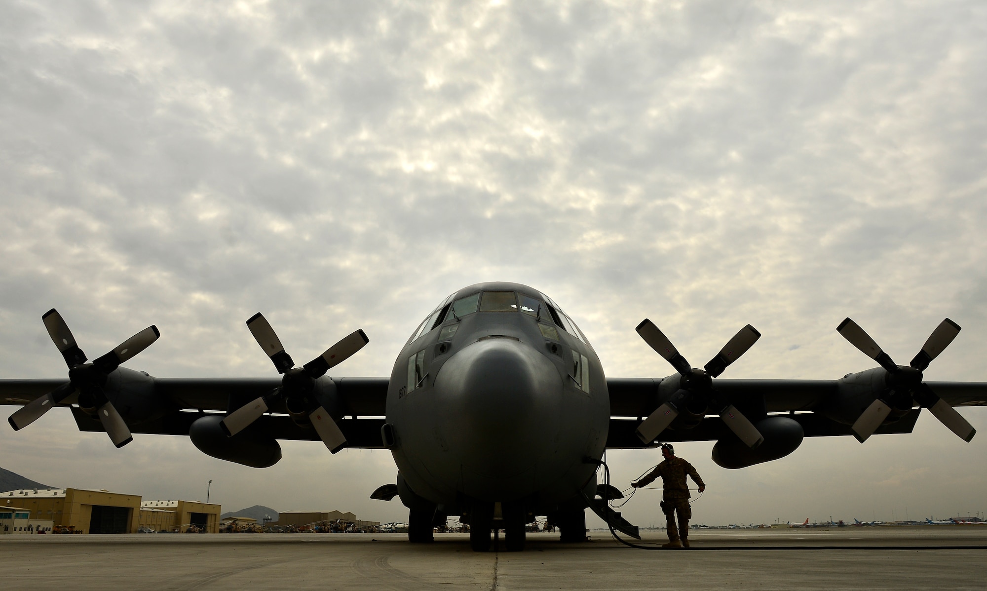 Tech. Sgt. Aaron Parkinson, 440th Expeditionary Advisory Squadron, C-130 Hercules crew chief, performs a pre-flight inspection, Kabul, Afghanistan, May 19, 2014. Parkinson and aircrew assigned to this C-130H1, are preparing the aircraft to transport Afghan Nation Army human remains. Parkinson, an Atlanta,Gerogia, native, is deployed from the 314th Aircraft Maintenance Unit, Little Rock, Arkansas. (U.S. Air Force photo by Staff Sgt. Vernon Young Jr.)