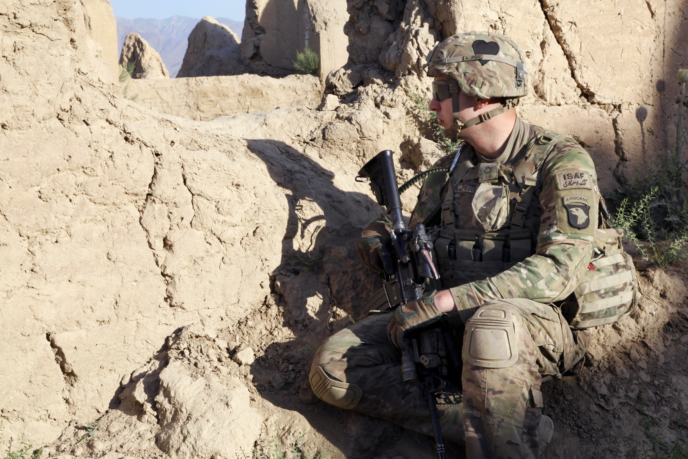 U.S. Army Pfc. Daniel Foote provides security inside an abandoned ...