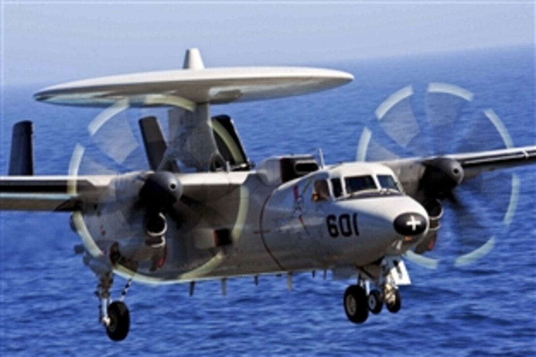 An E-2C Hawkeye prepares to land aboard the aircraft carrier USS George H.W. Bush in the Persian Gulf, June 16, 2014. Defense Secretary Chuck Hagel ordered the carrier to move from the North Arabian Sea into the Arabian Gulf to provide President Barack Obama additional flexibility should military options be required to protect American lives, citizens and interests in Iraq, Pentagon Press Secretary Navy Rear Adm. John Kirby said.