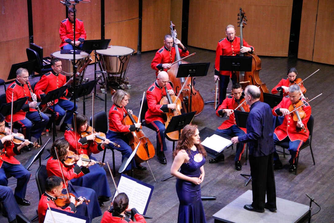 On May 18, 2014, the Marine Chamber Orchestra performed a concert titled “My End is My Beginning” at the Schlesinger Concert Hall in Alexandria, Va. Pictured: guest conductor James Ross and soprano soloist Bridgette Gan (U.S. Marine Corps photo by Staff Sgt. Rachel Ghadiali/released)