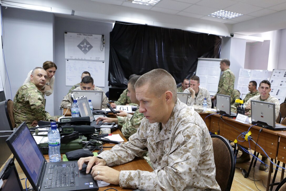 Marines from the 6th Marine Regiment and their Georgian Armed Forces counterparts from the Georgian 4th Mechanized Brigade, along with personnel from U.S. Marine Corps Forces Europe and Africa, conduct a command-post exercise during Agile Spirit 14, 9-21 June, at Vaziani Training Area, Georgia. The fourth iteration of Agile Spirit will unify the efforts of more than 250 Marines and 550 Georgian soldiers by conducting brigade and battalion-level training engagements through June 21. BSRF-14 provides U.S. Marine Forces Europe and Africa a robust, rotational capability to maintain proven partnerships and strategic friendships in the Black Sea, Balkans and Caucasus regions while providing a rapid-response capability to U.S. European Command. 