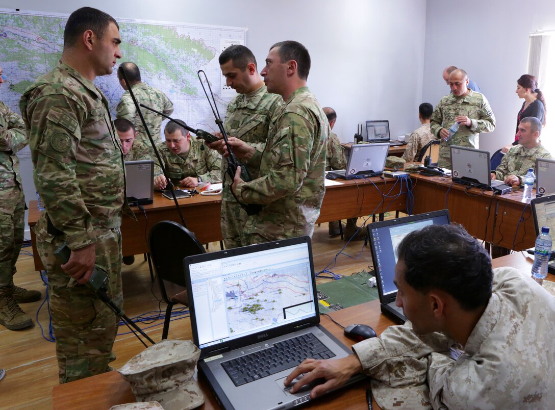 Marines from the 6th Marine Regiment and their Georgian Armed Forces counterparts from the Georgian 4th Mechanized Brigade, along with personnel from U.S. Marine Corps Forces Europe and Africa, conduct a command-post exercise during Agile Spirit 14, 9-21 June, at Vaziani Training Area, Georgia. The fourth iteration of Agile Spirit will unify the efforts of more than 250 Marines and 550 Georgian soldiers by conducting brigade and battalion-level training engagements through June 21. BSRF-14 provides U.S. Marine Forces Europe and Africa a robust, rotational capability to maintain proven partnerships and strategic friendships in the Black Sea, Balkans and Caucasus regions while providing a rapid-response capability to U.S. European Command. 

