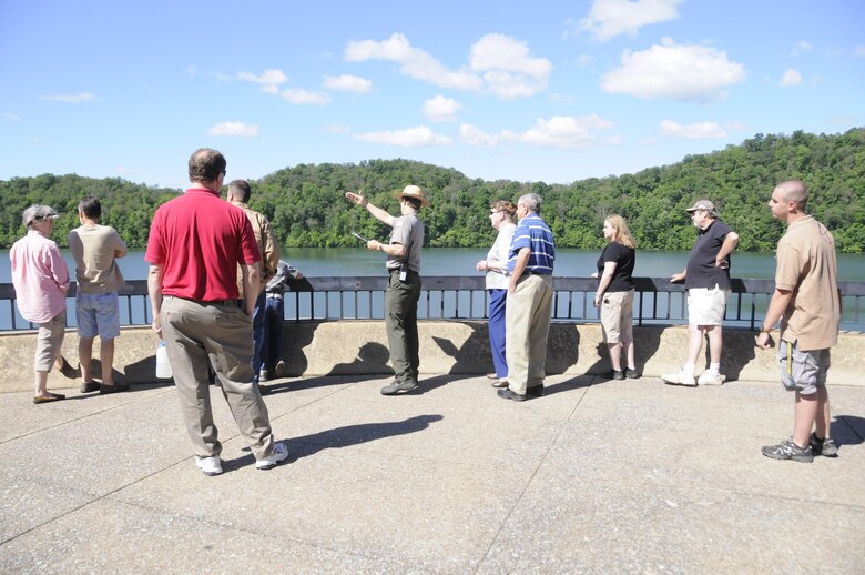 Supervisory Park Ranger Jude Harrington, U.S. Army Corps of Engineers, Baltimore District, guides a group of visitors through a tour of Raystown Dam on Friday, June 6. Thousands of people gathered to celebrate the 40th anniversary of Raystown Dam the weekend of June 6-8 with lake-wide festivities ranging from a Batlle of the Bands to a fireworks display. This was the first time the dam was opened to the public since before the terrorist attacks on Sept. 11, 2001.