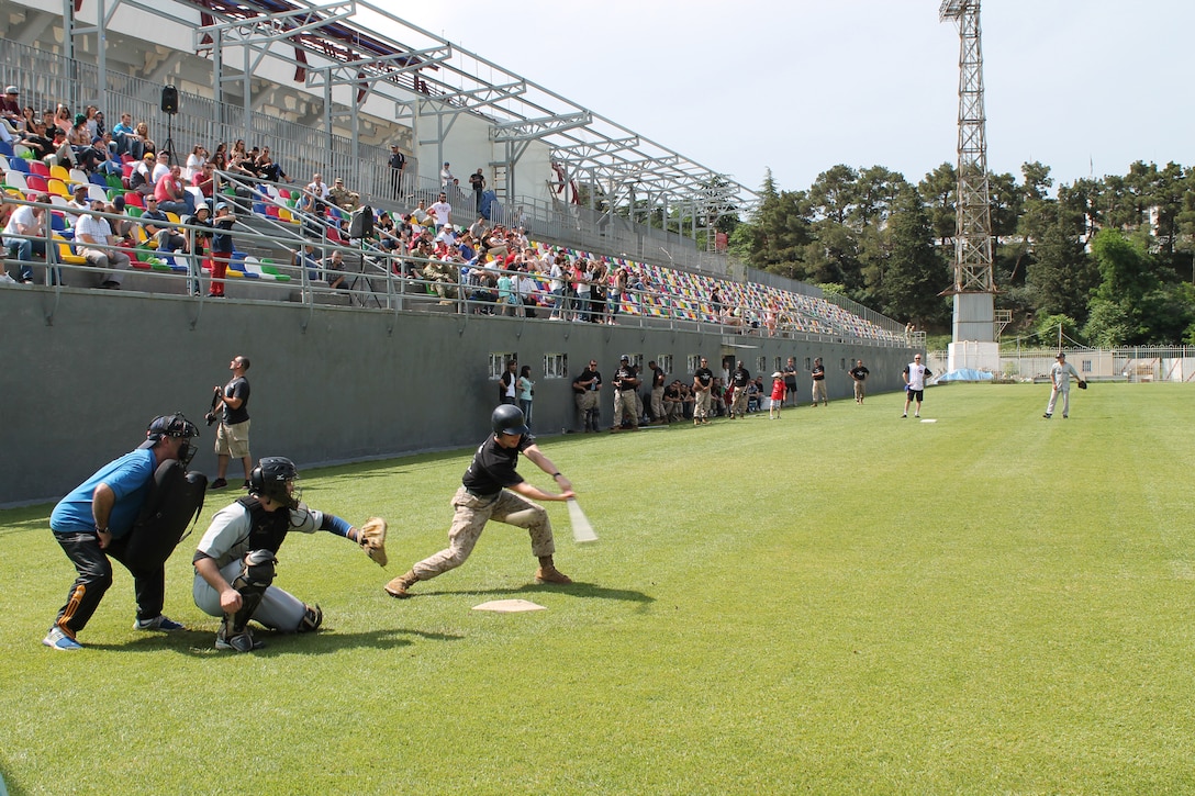 A player on the US Marines team prepares to bunt the ball during a May 31 baseball game at Meskhi Stadium, located in the Vake district of Tbilisi, Georgia, between the US Marines and the Georgian National Baseball Team. The game was hosted by the U.S. Embassy and the Georgian Ministry of Defense to raise awareness of the Georgian Wounded Warrior Program. The US Marines team was comprised of Marines assigned to the U.S. Embassy in Georgia and Marines assigned to the U.S. Marine Corps Forces Europe and Africa’s Georgia Deployment Program-ISAF. The Marine Forces Europe and Africa-led program has trained Georgian battalions to support ISAF missions in Afghanistan, serving alongside U.S. and other partner-nation’s forces.