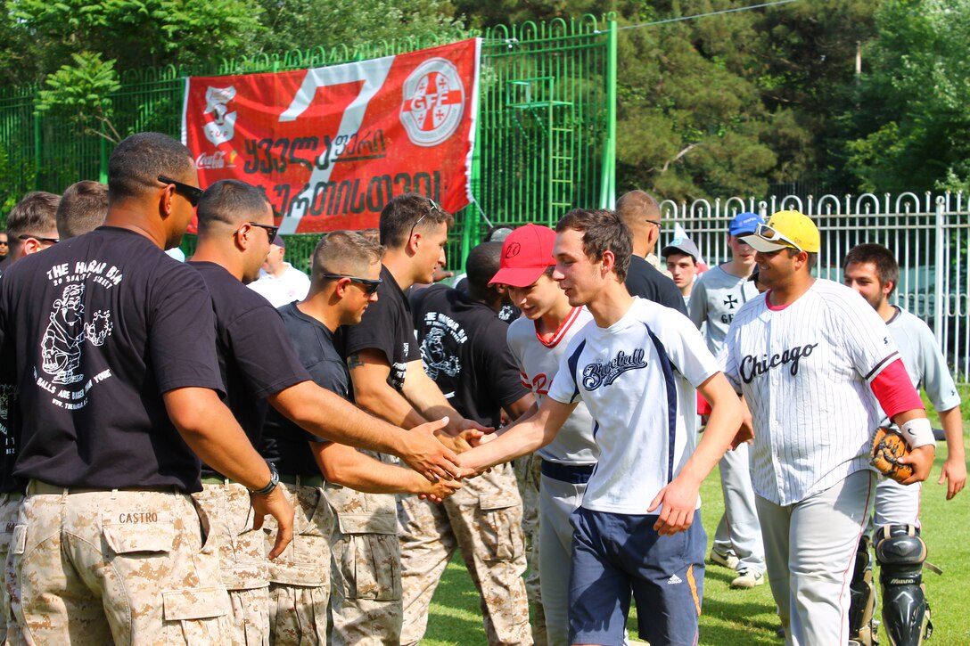 Players on the Georgian National Baseball Team and the US Marines team congratulate each other on a game well played at the conclusion of a baseball game at Meskhi Stadium, located in the Vake district of Tbilisi, Georgia, between the US Marines and the Georgian National Baseball Team. The game was hosted by the U.S. Embassy and the Georgian Ministry of Defense to raise awareness of the Georgian Wounded Warrior Program. The US Marines team was comprised of Marines assigned to the U.S. Embassy in Georgia and Marines assigned to the U.S. Marine Corps Forces Europe and Africa’s Georgia Deployment Program-ISAF. The Marine Forces Europe and Africa-led program has trained Georgian battalions to support ISAF missions in Afghanistan, serving alongside U.S. and other partner-nation’s forces.