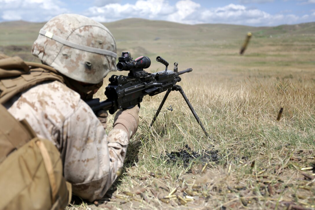 U.S. Marine Corps Lance Cpl. Aaron Keene of Black Sea Rotational Force from 3rd Battalion, 8th Marine Regiment fires an M249 light machine gun during a course of fire that also included the M4 service rifle and the M2 .50 caliber heavy machine gun during exercise Agile Spirit 14 at Vaziani Training Area, Georgia, June 11, 2014. This fourth iteration of the Agile Spirit exercise will run until 21 June, and includes live-fire training and a field exercise with both countries. The exercise is conducted with the Georgian Armed Forces within the Vaziani Training Area to increase partnership capacity and interoperability between the two nations. (U.S. Marine Corps photo by Lance Cpl. Samantha A. Barajas, 2nd Marine Division, Combat Camera/ Released)