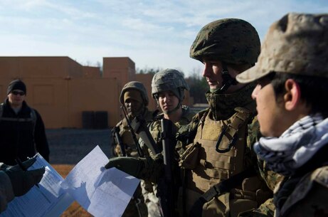 Marine Corps Information Operations Center (MCIOC), conducts training for Military Information Support Operations (MISO), at MOUT site, Quantico, Va., Feb. 11, 2014. MISO was training with actors to prepare personnel to complete future missions. (U.S. Marine Corps photo by Lance Cpl. Alexander Norred/Released)