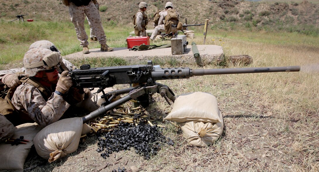 Navy Petty Officer 3rd Class James White, a corpsman with Black Sea Rotational Force 14, from 3rd Battalion, 8th Marine Regiment, accurately fires an M2 .50 caliber heavy machine gun on target during exercise Agile Spirit aboard Vaziani Training Area, Georgia, June 11, 2014. Agile Spirit 14 is an annually-scheduled multilateral engagement hosted by Georgia that began in 2011 in order to strengthen the two countries by conducting brigade and battalion-level training engagements, to include small-unit interaction between the Marines and Georgians that demonstrates their commitments toward collective, global security. (Official Marine Corps motion imagery by Lance Cpl. Scott W. Whiting, BSRF PAO/ Released)