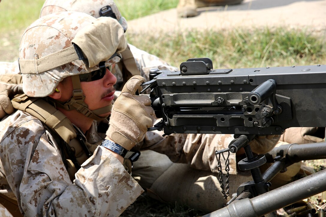 Navy Petty Officer 3rd Class James White, a corpsman with Black Sea Rotational Force 14, from 3rd Battalion, 8th Marine Regiment, accurately fires an M2 .50 caliber heavy machine gun on target during exercise Agile Spirit aboard Vaziani Training Area, Georgia, June 11, 2014. Agile Spirit 14 is an annually-scheduled multilateral engagement hosted by Georgia that began in 2011 in order to strengthen the two countries by conducting brigade and battalion-level training engagements, to include small-unit interaction between the Marines and Georgians that demonstrates their commitments toward collective, global security. (Official Marine Corps motion imagery by Lance Cpl. Scott W. Whiting, BSRF PAO/ Released)
