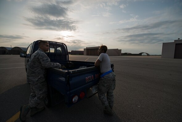 Senior Airman Kayla Dale chats with coworker Senior Airman Chad Smithwick before a job June 4, 2014, at Osan Air Base, South Korea. Dale is a 51st Maintenance Squadron non-destructive inspector and is responsible for identifying flaws or deficiencies in aircraft parts. (U.S. Air Force photo/Staff Sgt. Jake Barreiro)