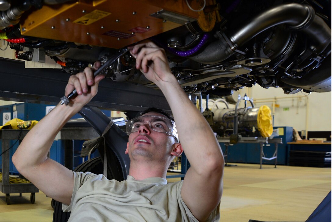 Airman 1st Class Tyler Susskind performs maintenance on an F-16 Fighting Falcon engine June 6, 2014, at Misawa Air Base, Japan. Susskind is one of about 80 Airmen who work at the engines back shop, where they’re responsible for all the engine maintenance on 44 F-16s stationed at Misawa AB. Susskind is a 35th Maintenance Squadron aerospace propulsion journeyman. (U.S. Air Force photo/Senior Airman Derek VanHorn)