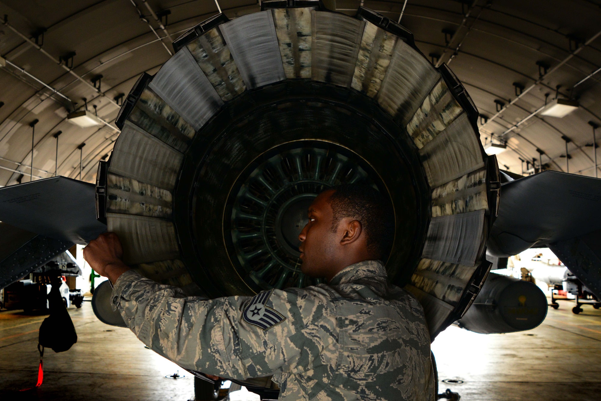Staff Sgt. Jeremy Howard inspects the exhaust of an F-16 Fighting Falcon June 6, 2014, at Misawa Air Base, Japan. Howard is one of about 10 flightline aerospace propulsion Airmen who perform on-the-fly maintenance for F-16 engines at Misawa AB. Howard is a 35th Aircraft Maintenance Squadron aerospace propulsion craftsman. (U.S. Air Force photo/Senior Airman Derek VanHorn)