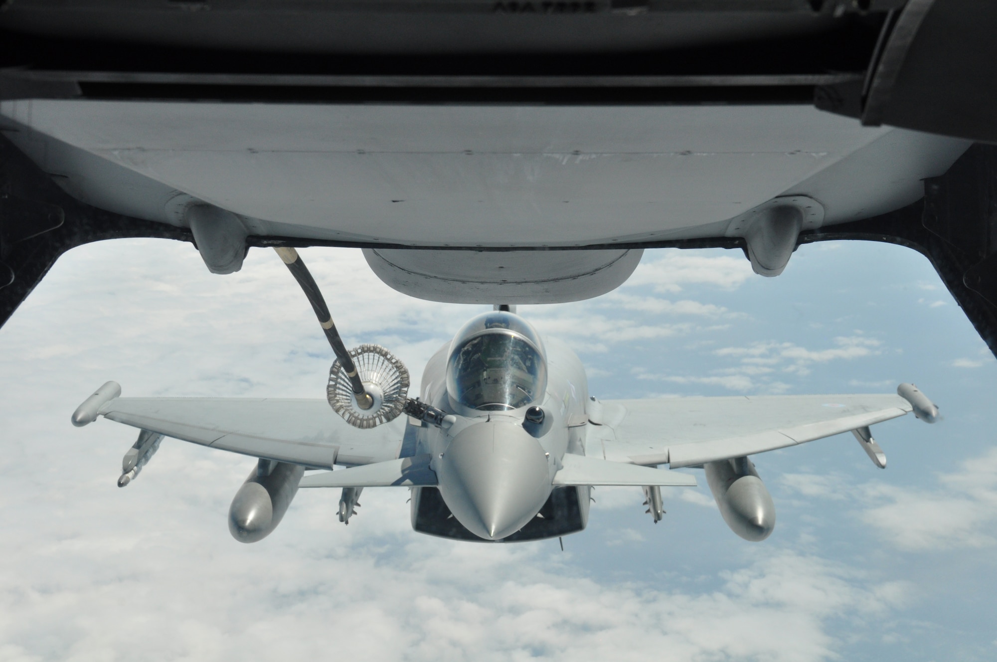 Royal Air Force pilots from the 6 Squadron flying the Eurofighter Typhoon get a rare opportunity to refuel from a KC-10 Extender piloted by Air Force Reserve aircrew stationed at Joint Base McGuire-Dix-Lakehurst, N.J, June 6, along a track near RAF Leuchars, United Kingdom. The training event took place on the 70th Anniversary of the allied invasion of Normandy, France during World War II. (U.S. Air Force photo/Master Sgt. Donna T. Jeffries)