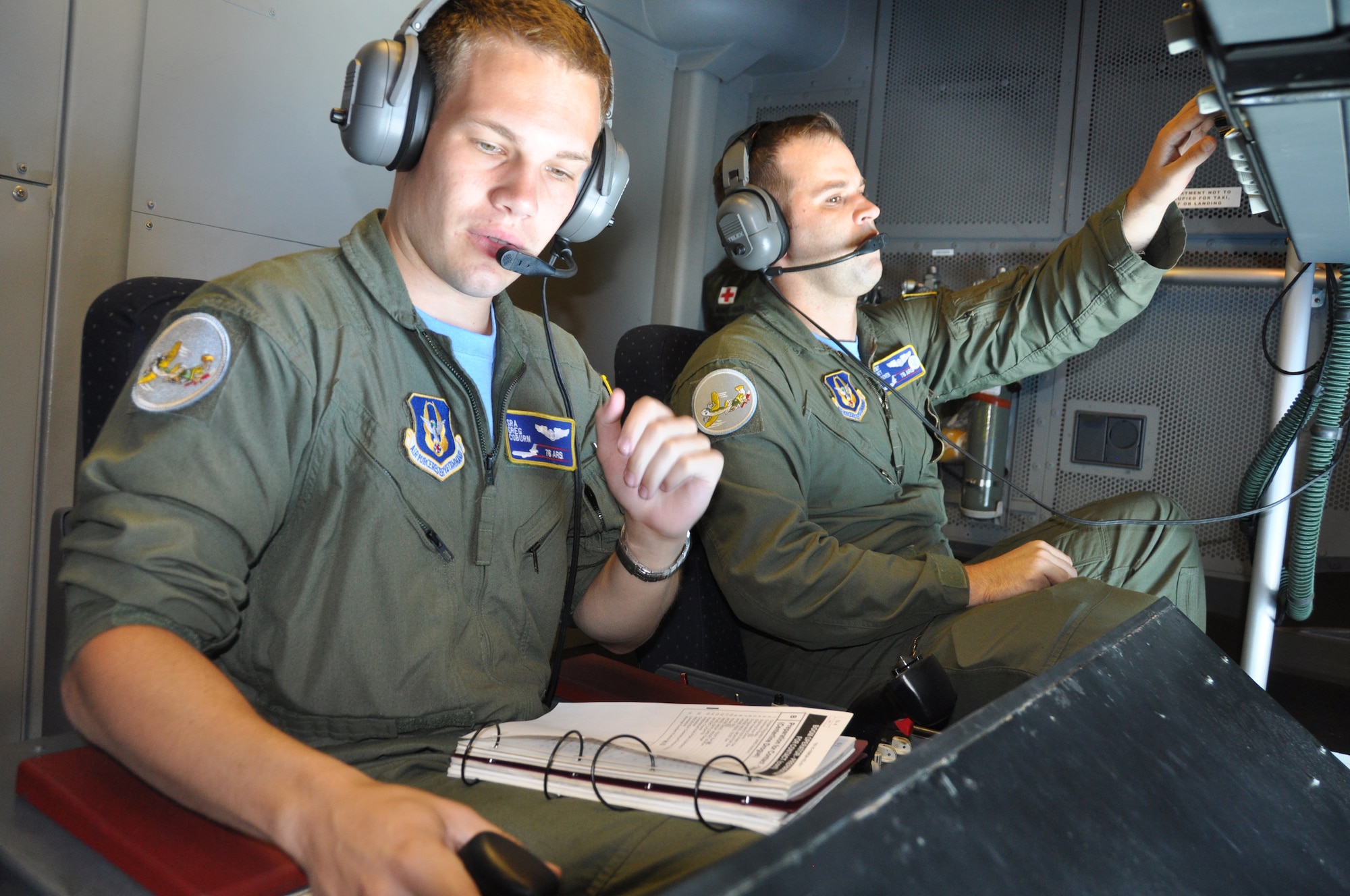 Senior Airman Gregory Coburn, left, a KC-10 Extender boom operator with the 78th Air Refueling Squadron at Joint Base McGuire-Dix-Lakekurst, N.J., readies the drogue to provide gas to a squadron of Eurofighter Typhoons stationed at Royal Air Force Leuchars, United Kingdom on June 6. Fellow wingman, Tech. Sgt. Matthew Bracken, a flight engineer, gets set to witness the U.S. tanker refuel the fighter aircraft. (U.S. Air Force photo/Master Sgt. Donna T. Jeffries)