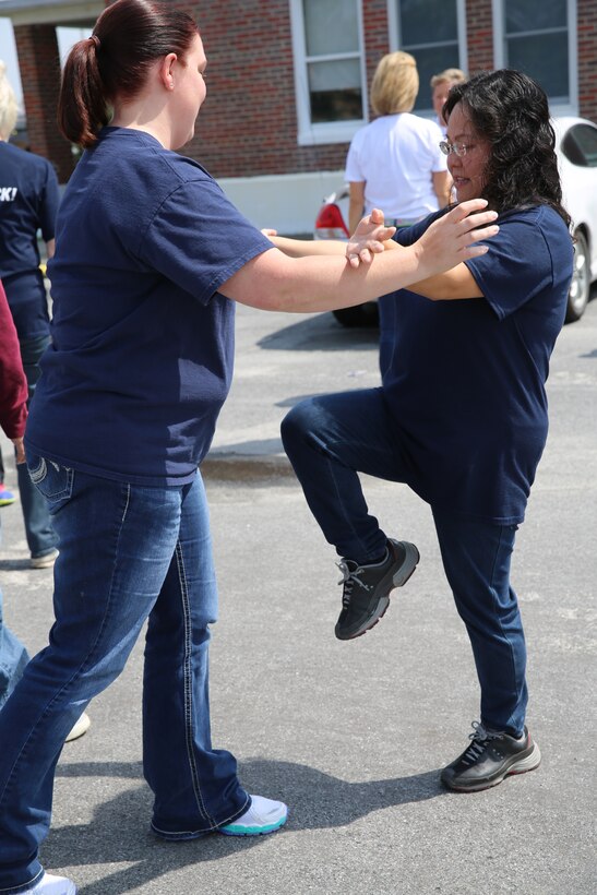 Kimberly Watcher (left) and Izzy Carnes (right) practice countering a front choke during a self-defense class held at Marine Corps Air Station Cherry Point, N.C., June 10, 2014. During the class, participants learned the importance of knowing self-defense and practiced several techniques that could aid them when confronted by a perpetrator. Watcher and Carnes are volunteers with the Navy Marine Corps Relief Society.


