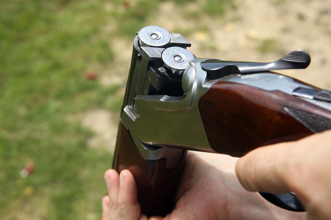 Sgt. Kristoffer Roberts prepares a shotgun while shooting wobble skeet at the Marine Corps Air Station Cherry Point Skeet Range, June 5, 2014. Roberts is the training noncommissioned officer for Marine Wing Communications Squadron 28. The Marines of MWCS-28 visited the range to foster camaraderie within the unit.