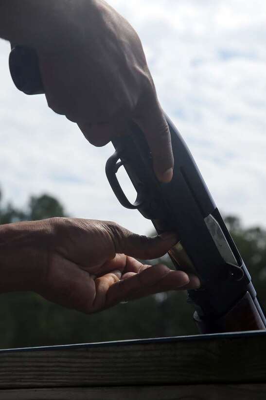 Gunnery Sgt. Marcus Jackson loads his shotgun during a game of wobble skeet at the Marine Corps Air Station Cherry Point Skeet Range, June 5, 2014. Jackson is the technical control chief of Marine Wing Communications Squadron 28. The Marines of MWCS-28 meet once a month to take an opportunity outside of work to foster unit cohesion and esprit de corps.