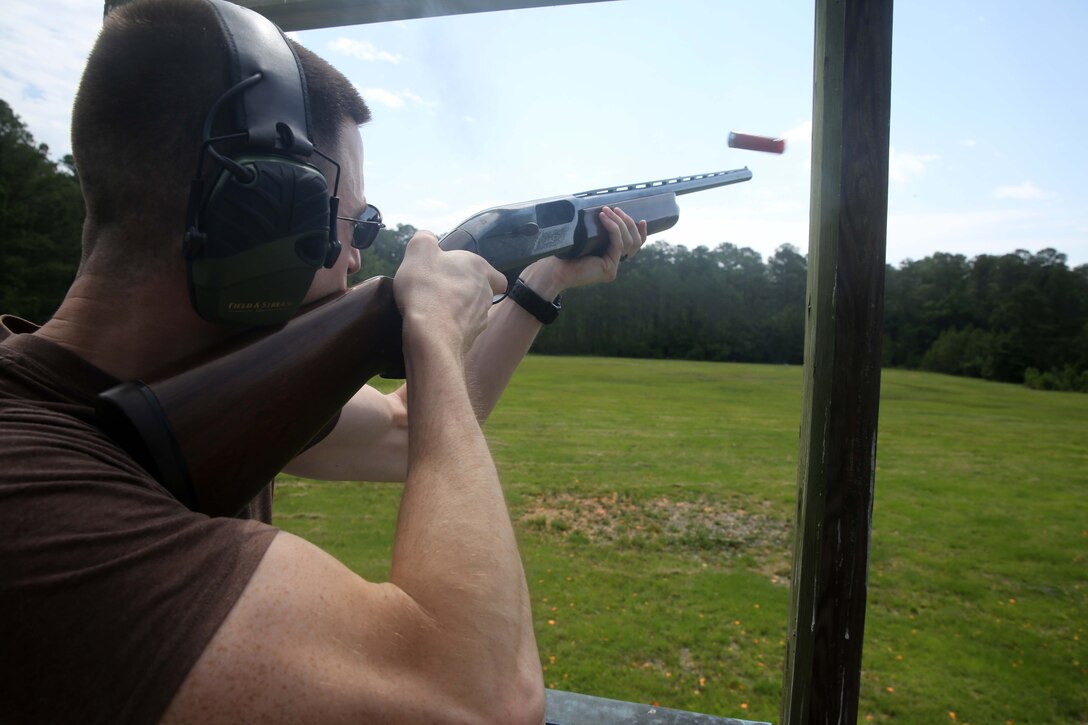 Staff Sgt. John Rydman fires a shotgun during a game of wobble skeet at the Marine Corps Air Station Cherry Point Skeet Range, June 5, 2014. Rydman is the cyber security chief at Marine Wing Communications Squadron 28. The Marines of MWCS-28 gather once a month in a relaxed environment to reinforce the warrior spirit. 