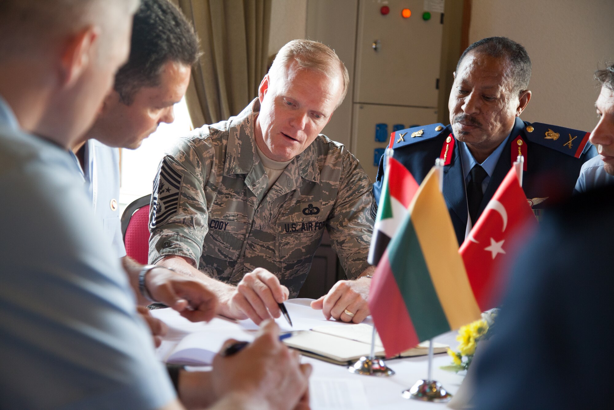 Chief Master Sgt. of the Air Force James Cody stops to chat with senior enlisted leaders from Georgia, Canada and United Kingdom during a tour of the Turkish air force NCO AcademyJune 12, 2014, in Izmir, Turkey. The tour was part of the Turkish Air Force International NCO Symposium, which brought together the top senior enlisted Airmen from 20 air forces around the world to exchange ideas and enhance interoperability. (U.S. Air Force photo/Senior Master Sgt. Lee E. Hoover Jr.)