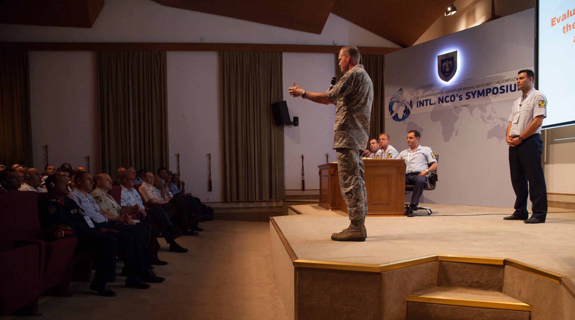 Chief Master Sgt. of the Air Force James Cody briefs attendees of the Turkish air force International NCO Symposium how the role of the Chief Master Sergeant of the U.S. Air Force has evolved since the first chief master sergeant of the Air Force, Paul Airey, June 9, 2014, in Istanbul, Turkey. Cody attended the symposium, which brought together the top senior enlisted Airmen from 20 Air Forces around the world to exchange ideas and enhance interoperability. (U.S. Air Force photo/Senior Master Sgt. Lee E. Hoover Jr.)