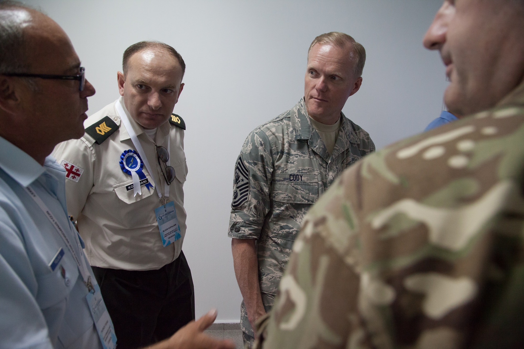Chief Master Sgt. of the Air Force James Cody stops to chat with senior enlisted leaders from Georgia, Canada and United Kingdom during a tour of the Turkish air force NCO Academy June 12, 2014, in Izmir, Turkey. The tour was part of the Turkish Air Force International NCO Symposium, which brought together the top senior enlisted Airmen from 20 air forces around the world to exchange ideas and enhance interoperability. (U.S. Air Force photo/Senior Master Sgt. Lee E. Hoover Jr.)