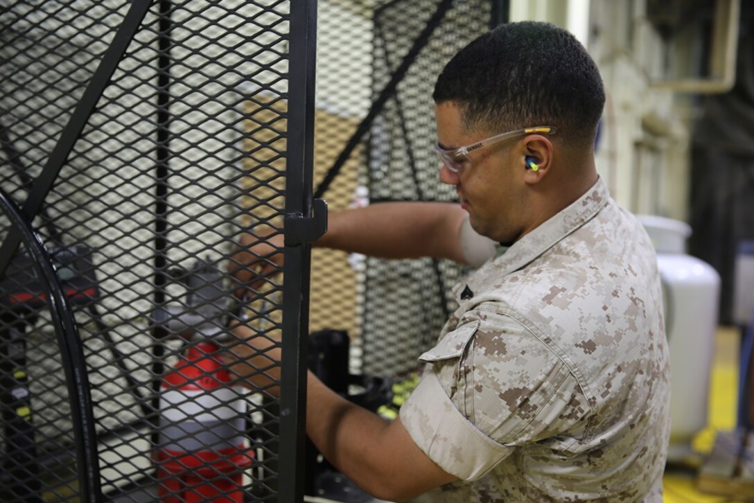 Staff Sergeant Kevin Jones, Corporals Samuel Harney, Zach Carnegie, Jonathan Manciniand, Lance Cpls. Michael Solis, and Chandler Bird, worked hands-on with mechanics from Production Plant Barstow, Marine Depot Maintenance Command on Marine Corps Logistics Base Barstow, Calif., from May 22 to May 30. Arthur Gutierrez, hydraulics system mechanic and Luke Wirick, heavy mobile equipment mechanic, trained and certified the Marines to fill discharge, and test automatic fire suppression systems (AFSS).
