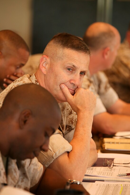 Col. Edmund J. Bowen listens to a briefing June 10 during a two-day commander’s conference  at the Surfside on Camp Kinser. The conference was held for the leadership of 3rd Marine Logistics Group to discuss ways to improve training, morale and overall leadership. Bowen is the commanding officer of Combat Logistics Regiment 37, 3rd MLG, III Marine Expeditionary Force. (U.S. Marine Corps photo by Lance Cpl. Brittany A. James/ Released)