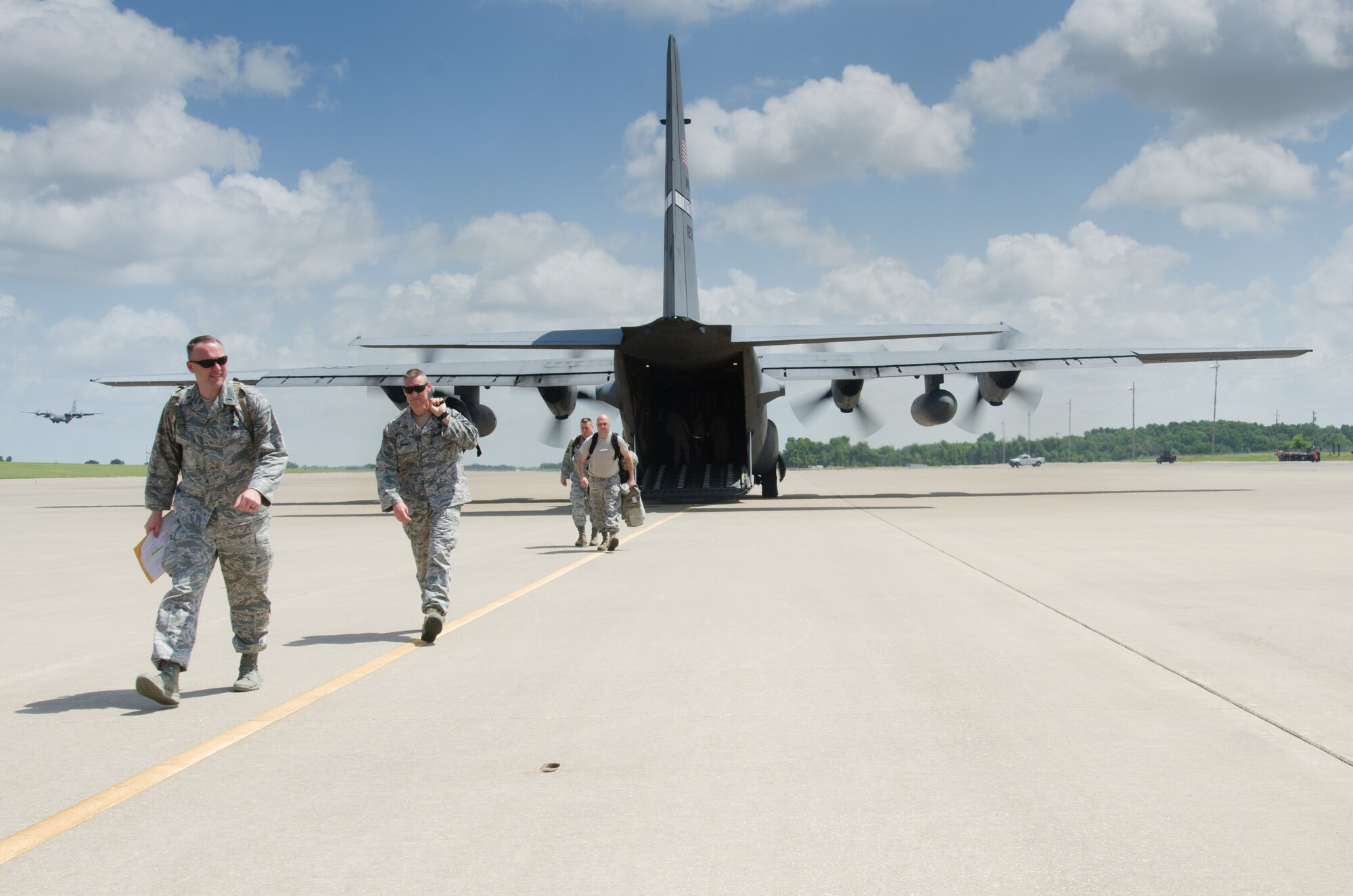 Airmen from the Kentucky Air National Guard’s 123rd Contingency Response Group arrive at Fort Campbell, Ky., June 17, 2014, via a Kentucky Air Guard C-130 Hercules to participate in Capstone '14, a homeland earthquake-response exercise. The 123rd CRG is joining with the U.S. Army’s 688th Rapid Port Opening Element to operate a Joint Task Force-Port Opening here from June 16 to 19, 2014. (U.S. Air National Guard photo by Master Sgt. Phil Speck)